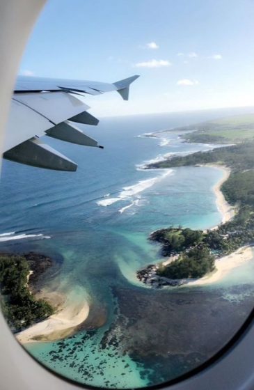 Young male actor posing confidently outdoors — representing modeling and travel lifestyle